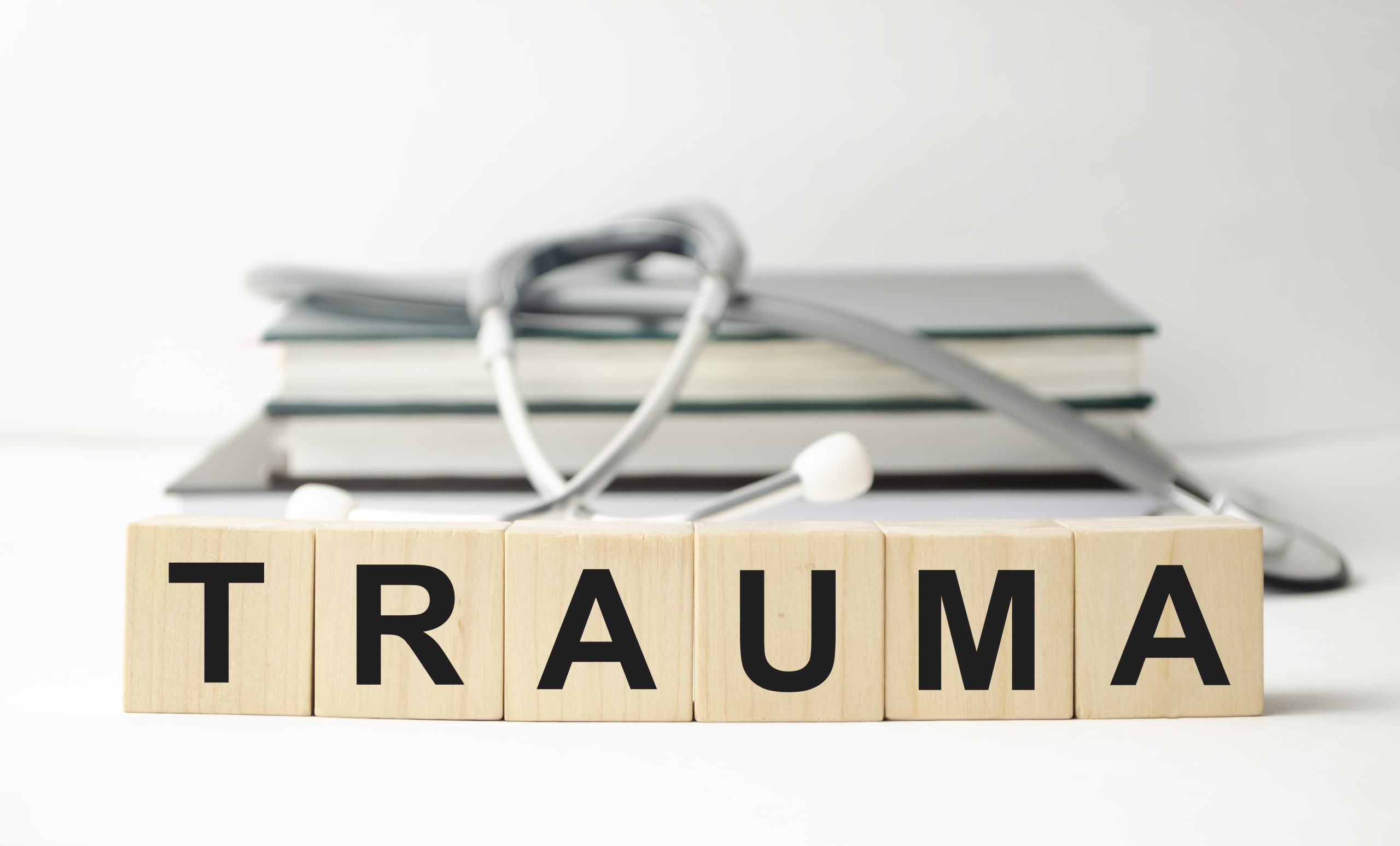 The word trauma written on wooden cubes vecteezy_the-word-trauma-written-on-wooden-cubes_