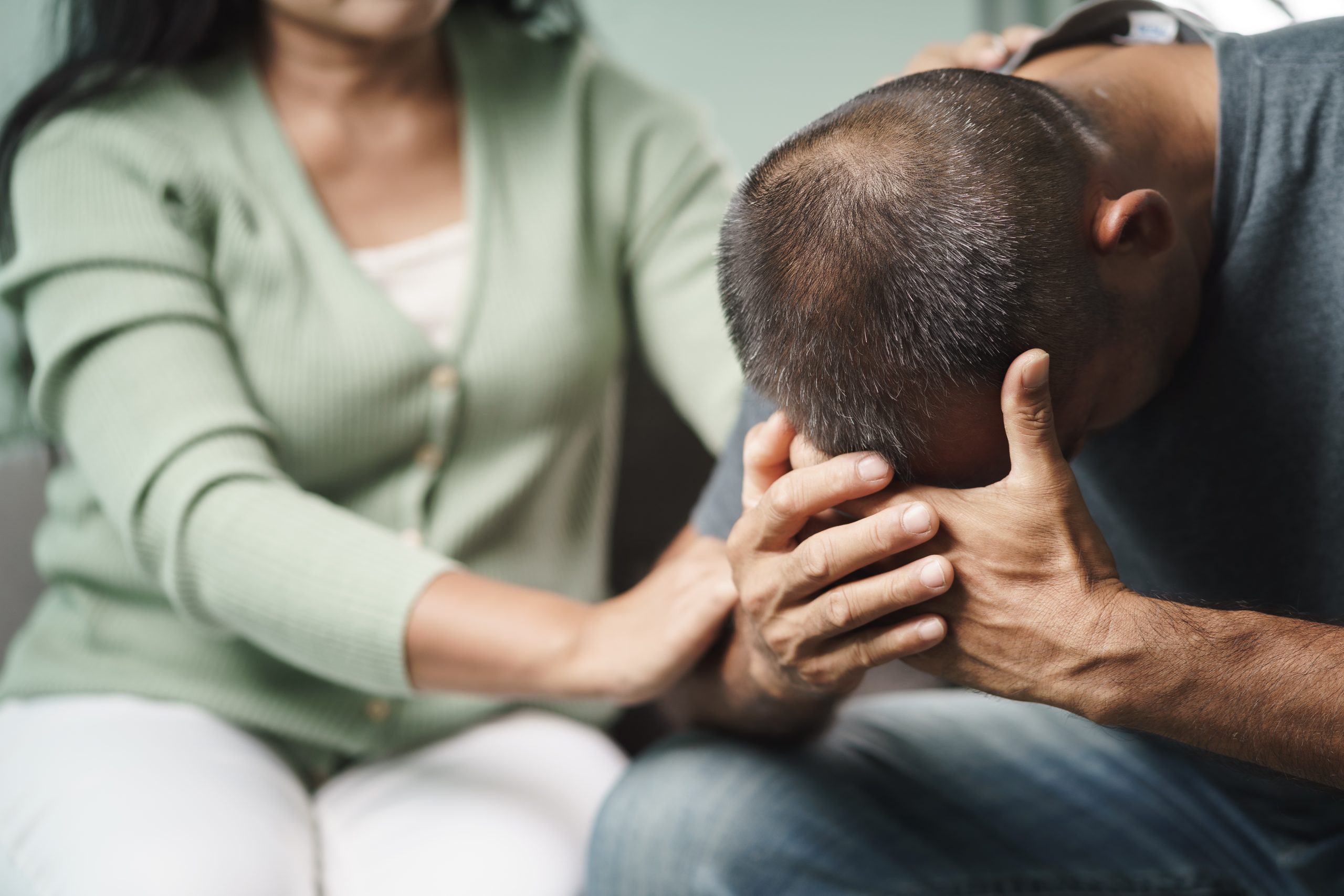 Female Psychologist, friend or family sitting and put hands on t rauma counselling support at Eleos Counselling in West Sussex